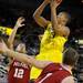 Indiana guard Verdell Jones III, left, and guard Jordan Hulls, right, try to block a shot by Michigan guard Trey Burke. Angela J. Cesere | AnnArbor.com
