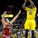 Indiana guard Jordan Hulls, left, tries to block a shot by Michigan guard Tim Hardaway Jr. Angela J. Cesere | AnnArbor.com
