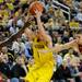 Michigan guard Stu Douglass, center, tries to keep the ball away from Indiana guard Matt Roth, right, and guard Victor Oladipo. Angela J. Cesere | AnnArbor.com
