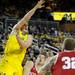 Indiana guard Matt Roth, center, watches as Michigan guard Stu Douglass, passes the ball from under the basket. Angela J. Cesere | AnnArbor.com
