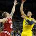 Michigan forward Jordan Morgan, right, takes a shot while Indiana forward Derek Elston jumps to block him. Angela J. Cesere | AnnArbor.com

