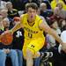 Michigan guard Zack Novak dribbles down the court. Angela J. Cesere | AnnArbor.com
