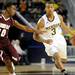 Alabama A&M guard Jeremy Crutcher, left, tries to block Michigan guard Trey Burke as he dribbles down the court. Angela J. Cesere | AnnArbor.com