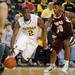 Michigan guard Carlton Brundidge dribbles around Alabama A&M guard Demarquelle Tabb. Angela J. Cesere | AnnArbor.com