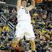Michigan forward Zack Novak makes a slam dunk. Angela J. Cesere | AnnArbor.com