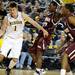Michigan guard Stu Douglas dribbles toward the basket. Angela J. Cesere | AnnArbor.com