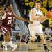 Alabama A&M guard Marcus Lee, left, tries to block Michigan guard Zack Novak as he passes the ball. Angela J. Cesere | AnnArbor.com