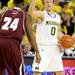 Alabama A&M guard Marcus Lee, left, watches as Michigan guard Zack Novak calls a play . Angela J. Cesere | AnnArbor.com