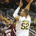 Alabama A&M forward Jerome Hunter, left, tries to block a shot by Michigan forward Jordan Morgan. Angela J. Cesere | AnnArbor.com