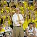 Michigan head coach John Beilein watches a free throw shot as the Maize Rage cheers behind him. Angela J. Cesere | AnnArbor.com