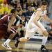Alabama A&M guard Green Hill, left, tries to block Michigan guard Stu Douglas as he dribbles down the court. Angela J. Cesere | AnnArbor.com