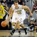 Michigan guard Josh Bartelstein dribbles down the court. Angela J. Cesere | AnnArbor.com