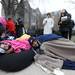 Michigan students Neil Patel, right, and Saba Javadi, curl up in blankets and a bean bag toward the front of the line. They were the 220th and 221st people in line, arriving around 11:30 pm the previous night. Angela J. Cesere | AnnArbor.com
