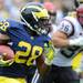 Michigan sophomore running back Fitzgerald Toussaint carries the ball during the football game against SDSU at Michigan Stadium on Sept. 24, 2011. Angela J. Cesere | AnnArbor.com