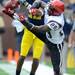 San Diego State defensive back Larry Parker blocks a catch by junior wide receiver Roy Roundtree during the football game at Michigan Stadium on Sept. 24, 2011. Angela J. Cesere | AnnArbor.com