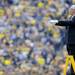 Michigan Director of Band Michael Haithcock directs the Michigan Marching Band in the National Anthem at Michigan Stadium before the football game against San Diego State on Sept. 24, 2011. Angela J. Cesere | AnnArbor.com