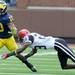 San Diego State defensive back Larry Parker dives for Michigan sophomore wide receiver Jeremy Gallon during the football game at Michigan Stadium on Sept. 24, 2011. Angela J. Cesere | AnnArbor.com