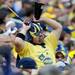 A Michigan fan dances to the Rocky and Bullwinkle song played by the Michigan Marching Band during the football game against San Diego State at Michigan Stadium on Sept. 24, 2011. Angela J. Cesere | AnnArbor.com