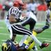 Michigan sophomore cornerback Courtney Avery takes down San Diego State wide receiver Colin Lockett during the football game at Michigan Stadium on Sept. 24, 2011. Angela J. Cesere | AnnArbor.com