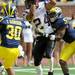 Michigan sophomore cornerback Courtney Avery, right, and sophomore safety Thomas Gordon, left, try to block a touchdown by wide receiver Colin Lockett during the football game at Michigan Stadium on Sept. 24, 2011. Angela J. Cesere | AnnArbor.com