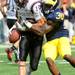 Michigan sophomore safety Thomas Gordon tries to bring down San Diego State wide receiver Dylan Denso during the football game at Michigan Stadium on Sept. 24, 2011. Angela J. Cesere | AnnArbor.com