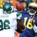 Eastern Michigan defensive lineman Brandon Slater tries to block a pass by Michigan junior quarterback Denard Robinson during the football game at Michigan Stadium on Saturday. Angela J. Cesere | AnnArbor.com