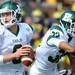 Eastern Michigan quarter back Alex Gillett fakes a pass to running back Javonti Green during the football game against Michigan at Michigan Stadium on Saturday. Angela J. Cesere | AnnArbor.com