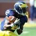 Michigan junior running back Vincent Smith returns a kick during the football game against Eastern Michigan at Michigan Stadium on Saturday. Angela J. Cesere | AnnArbor.com