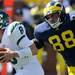 Michigan junior defensive end Craig Roh runs to tackle Eastern Michigan quarter back Alex Gillett during the football game at Michigan Stadium on Saturday. Angela J. Cesere | AnnArbor.com