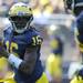 Michigan junior quarterback Denard Robinson looks down the field for a pass during the football game against Eastern Michigan at Michigan Stadium on Saturday. Angela J. Cesere | AnnArbor.com