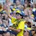 A Michigan fan dances to the Michigan March Band's rendition of the theme from the Blues Brothers during the football game against Eastern Michigan at Michigan Stadium on Saturday. Angela J. Cesere | AnnArbor.com