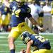 Michigan sophomore wide reciever Drew Dileo holds the ball for sophomore place kicker Brendan Gibbons to score a field goal during the football game at Michigan Stadium on Saturday. Angela J. Cesere | AnnArbor.com