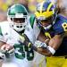 Michigan junior cornerback J.T. Floyd takes down Eastern Michigan running back Dominique White during the football game at Michigan Stadium on Saturday. Angela J. Cesere | AnnArbor.com