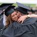 University of Michigan students Whitney Spain and Andrew Loginsky hug while heading to their seats before the 2012 commencement ceremony at Michigan Stadium. Angela J. Cesere | AnnArbor.com