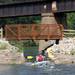 Warren residents Josh Crowton, front, and Adam Bliznick, paddle in a kayak through the entrance to the Argo Cascades. Angela J. Cesere | AnnArbor.com 