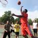 20-year-old Washington Square resident Marvin Wilson shoots the ball during a three-on-three basketball tournament. Angela J. Cesere | AnnArbor.com 