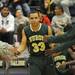 Huron's Mike Lewis runs through teammates after being introduced before the game against Saline. Angela J. Cesere | AnnArbor.com