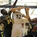 Huron's Nick Perkins, left, and Andre Bond, right, fight Saline's Michael Smutny for the rebound. Angela J. Cesere | AnnArbor.com