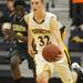 Huron's Yante Jackson, left, tries to chase down Saline's Garrett Stark as he dribbles down the court. Angela J. Cesere | AnnArbor.com