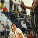 Saline's Kevin Moss, left, hesitates to shoot while Huron's Antonio Henry jumps to block it. Angela J. Cesere | AnnArbor.com