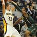 Huron's Andre Bond, right, reaches in towards Saline's Michael Hendrickson for the ball. Angela J. Cesere | AnnArbor.com
