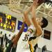 Huron's Antonio Henry, left, tries to block a shot by Saline's K.C. Borseth. Angela J. Cesere | AnnArbor.com