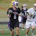 Pioneer's Zachary Delph, left, looks for a pass while Holt's Paul Schalau tries to block him during the MHSAA lacrosse semi-finals game at Parker Stadium in Howell, Mich. on Wednesday evening. Angela J. Cesere | AnnArbor.com