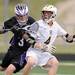 Pioneer's Louis Marr tries to block Holt's Erick Sundstrom from the goal during the MHSAA lacrosse semi-finals game at Parker Stadium in Howell, Mich. on Wednesday evening. Angela J. Cesere | AnnArbor.com