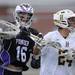 Pioneer's Peter Burke, left, knocks the ball out of the net of Holt's Abe Flores during the MHSAA lacrosse semi-finals game at Parker Stadium in Howell, Mich. on Wednesday evening. Angela J. Cesere | AnnArbor.com