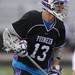 Pioneer's Taylor Zdanowski looks for a pass during the MHSAA lacrosse semi-finals game against Holt at Parker Stadium in Howell, Mich. on Wednesday evening. Angela J. Cesere | AnnArbor.com