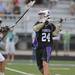 Pioneer's Eric Loveless, right, passes the ball during overtime of the MHSAA lacrosse semi-finals game against Holt at Parker Stadium in Howell, Mich. on Wednesday evening. Angela J. Cesere | AnnArbor.com