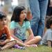 From left: Ann Arbor residents Aiden Le, age 8, sister Gabrielle Le, age 9, and brother Aaron, age 3, watch a sword fighting show put on by the Society for Creative Anachronism at the Saline Celtic Festival. Angela J. Cesere | AnnArbor.com 