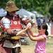 Ann Arbor Sword Club member Matthew Stewart Fulton, left, shows 8-year-old Ann Arbor resident Zhanna Carlson, right, how to hold her sword. Angela J. Cesere | AnnArbor.com 
