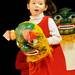 5-year-old Ann Malinowski runs with a mask for the Lohan Teasing Lion program at the Ann Arbor Chinese School Cinese New Year Celebration on Saturday. Angela J. Cesere | AnnArbor.com
